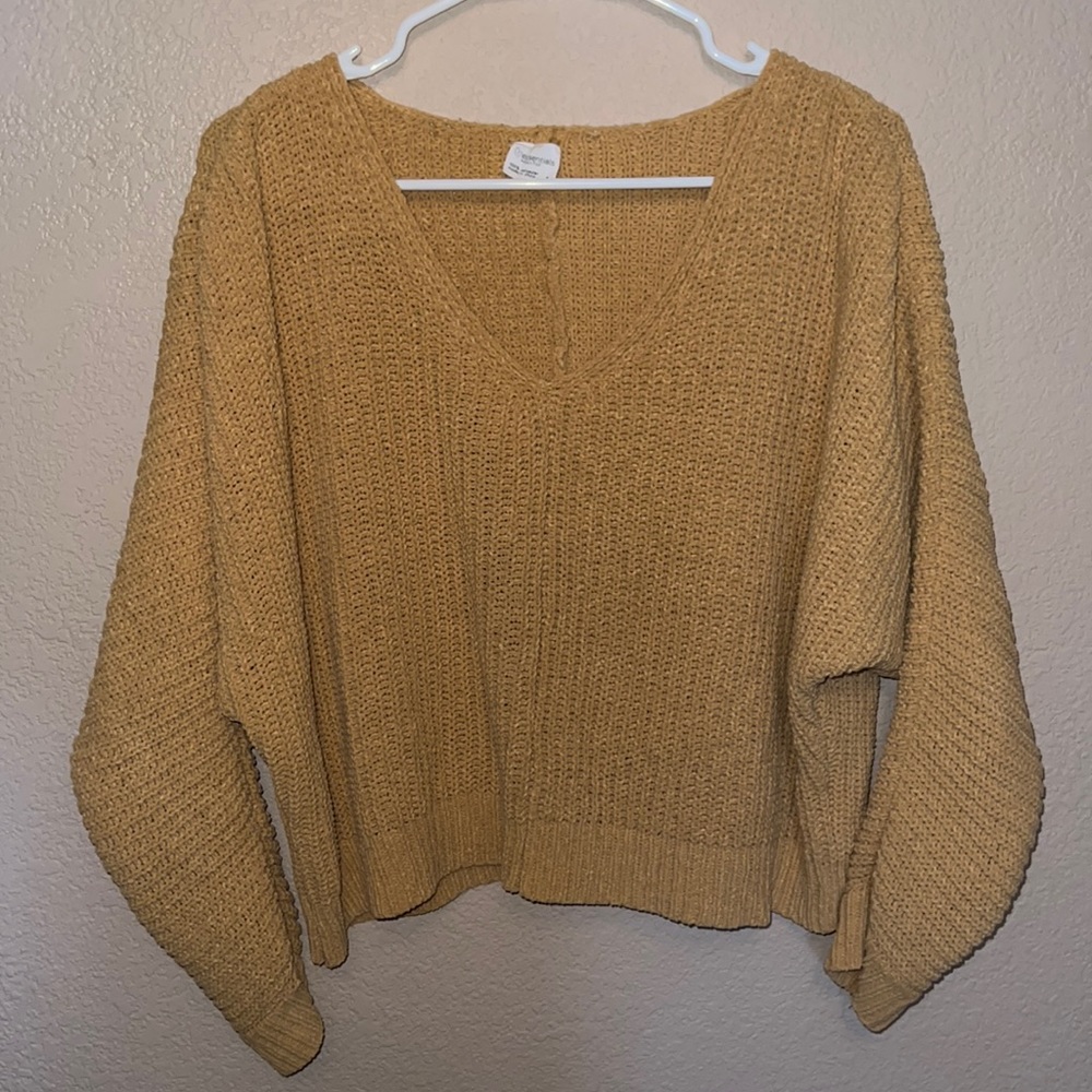 Cropped, thick yellow sweater.